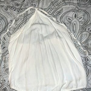 It’s a white neck tank, have been worn 3 times, Size Medium.